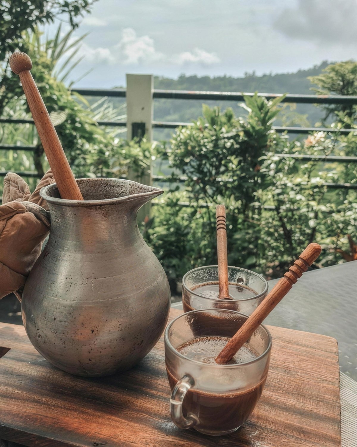 Tsokolate whisked with a wooden batirol, served with a silver pot
